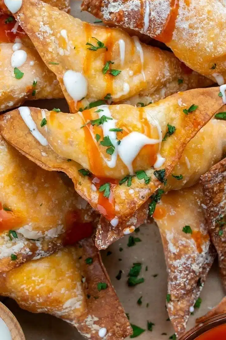 Crispy Air Fryer Buffalo Chicken Wontons served with dipping sauce