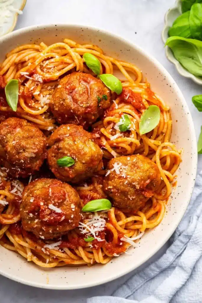 Crispy air fryer turkey meatballs served with a side of marinara sauce.