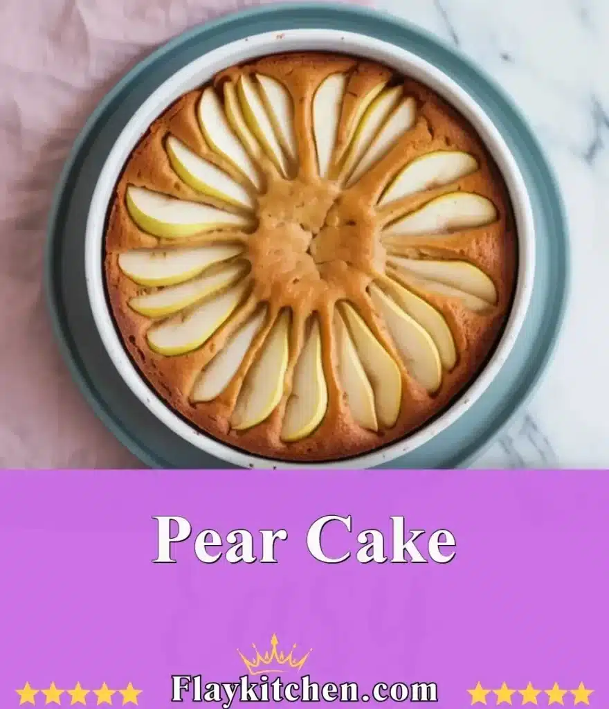 Delicious pear cake topped with fresh pear slices and a dusting of powdered sugar.