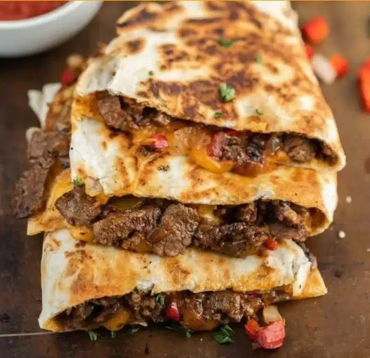 Steak Fajita Quesadillas with grilled steak, peppers, and cheese melted in a tortilla