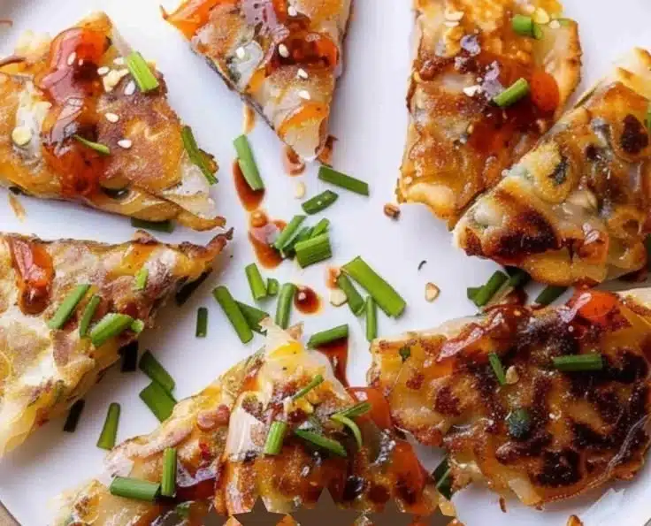 Delicious crispy rice pancakes served with a spicy dipping sauce