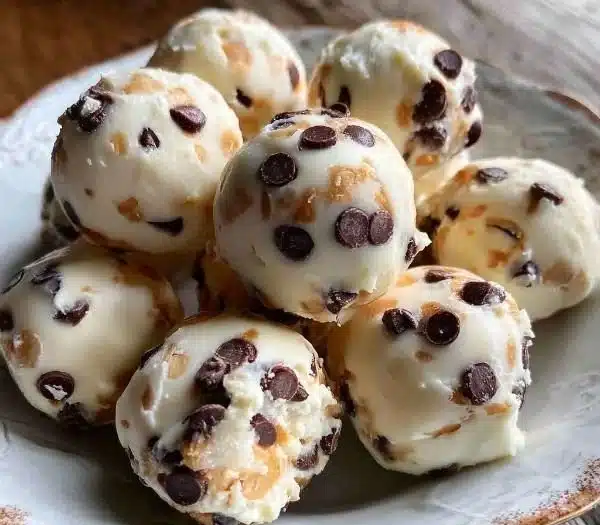 Frozen Greek Yogurt Bites with peanut butter and chocolate chips on a plate