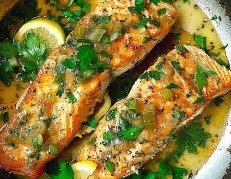 Delicious garlic butter seared trout garnished with lemon and parsley