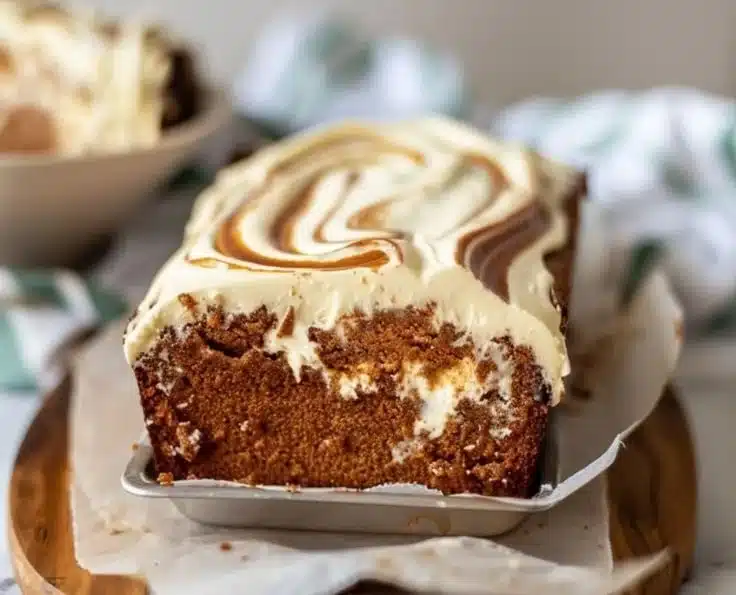 Ginger Molasses Cream Cheese Swirl Loaf 6 Ginger molasses loaf with cream cheese swirl on a wooden table