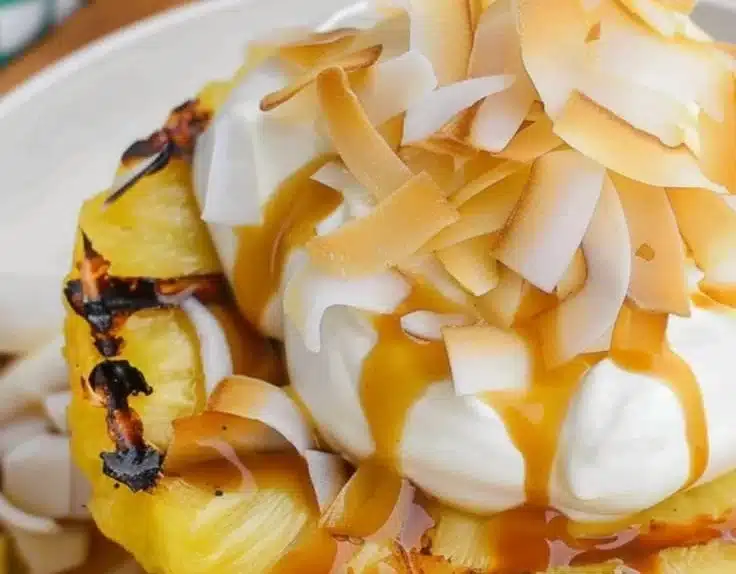 Delicious grilled pineapple slices served with coconut cream