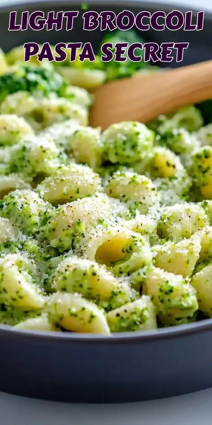 Light and healthy broccoli pasta dish garnished with fresh herbs and served in a bowl.
