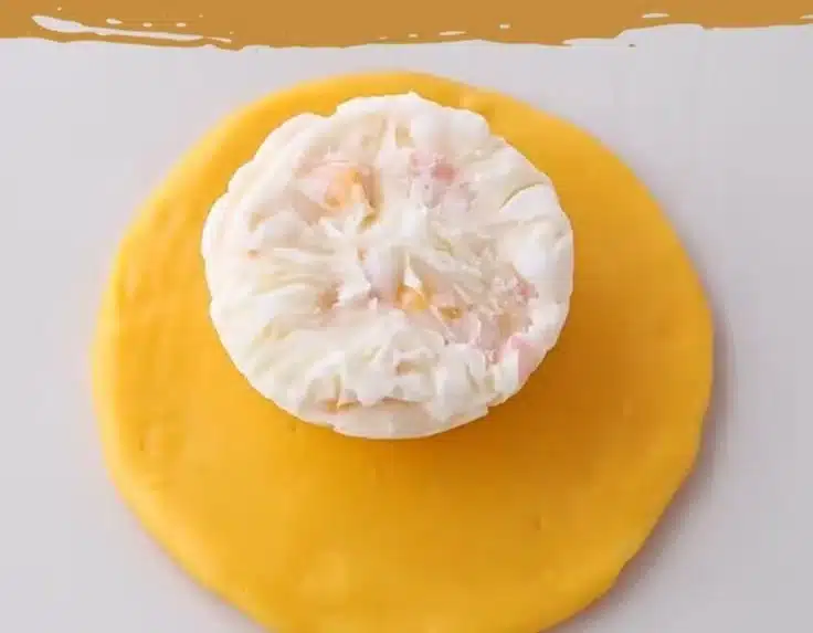 Mango Pomelo Sago Snow Skin Mooncakes on a decorative plate.