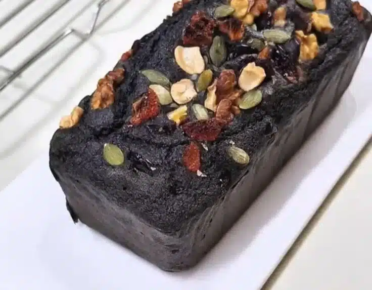 Black Sesame Pound Cake sliced, showcasing its moist texture and rich color.