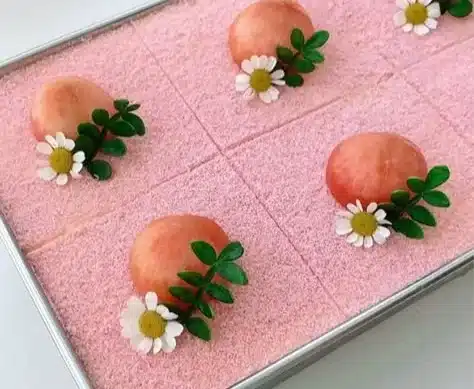 Peach Oolong Tiramisu 2 Delicious Peach Oolong Tiramisu dessert with peach slices and tea-infused cream.