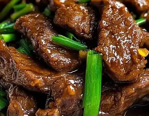 Delicious slow cooker Mongolian beef served with rice and vegetables