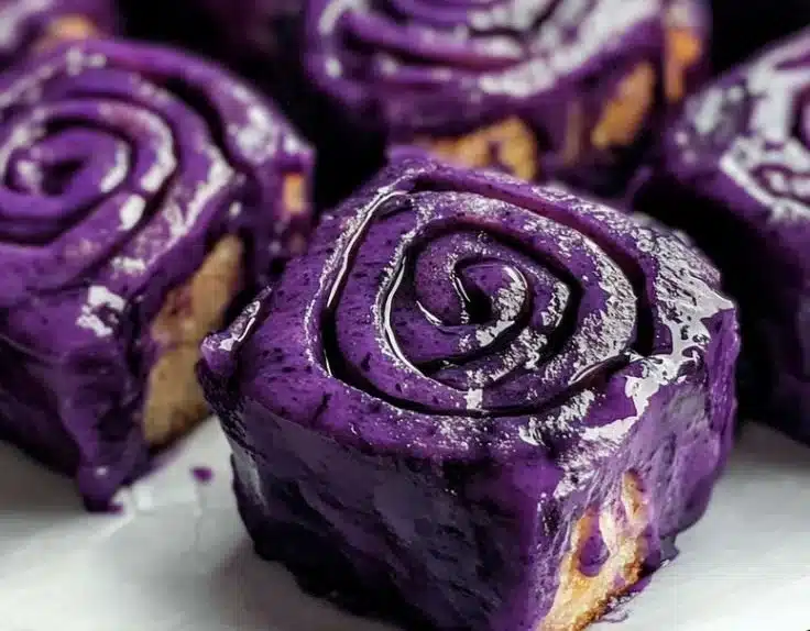 Vegan Ube Rolls 8 Vegan Ube Rolls baked with purple yam, a delightful plant-based dessert.