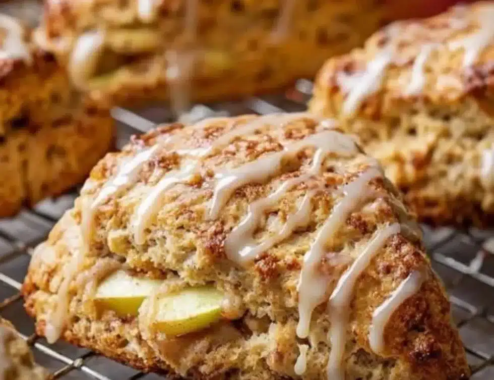 Freshly baked apple scones topped with a sweet maple glaze