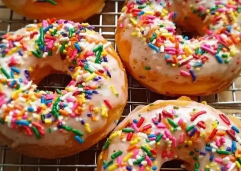 Baked Funfetti donuts with protein, topped with colorful sprinkles.