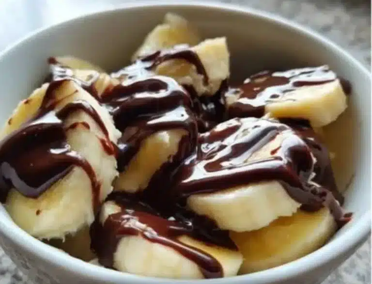 Delicious banana chocolate dessert with creamy chocolate sauce and fresh banana slices