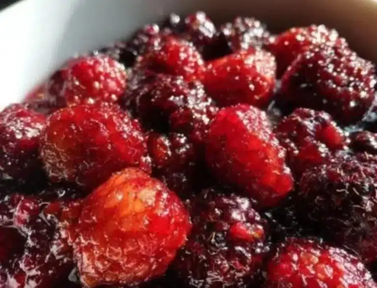 Delicious Berry Brulee dessert topped with fresh berries and caramelized sugar.