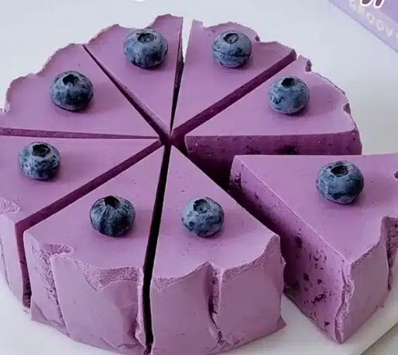 Delicious blueberry yogurt mousse cake with creamy layers and fresh blueberries