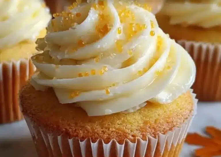 Cornbread cupcakes topped with honey butter frosting on a white plate