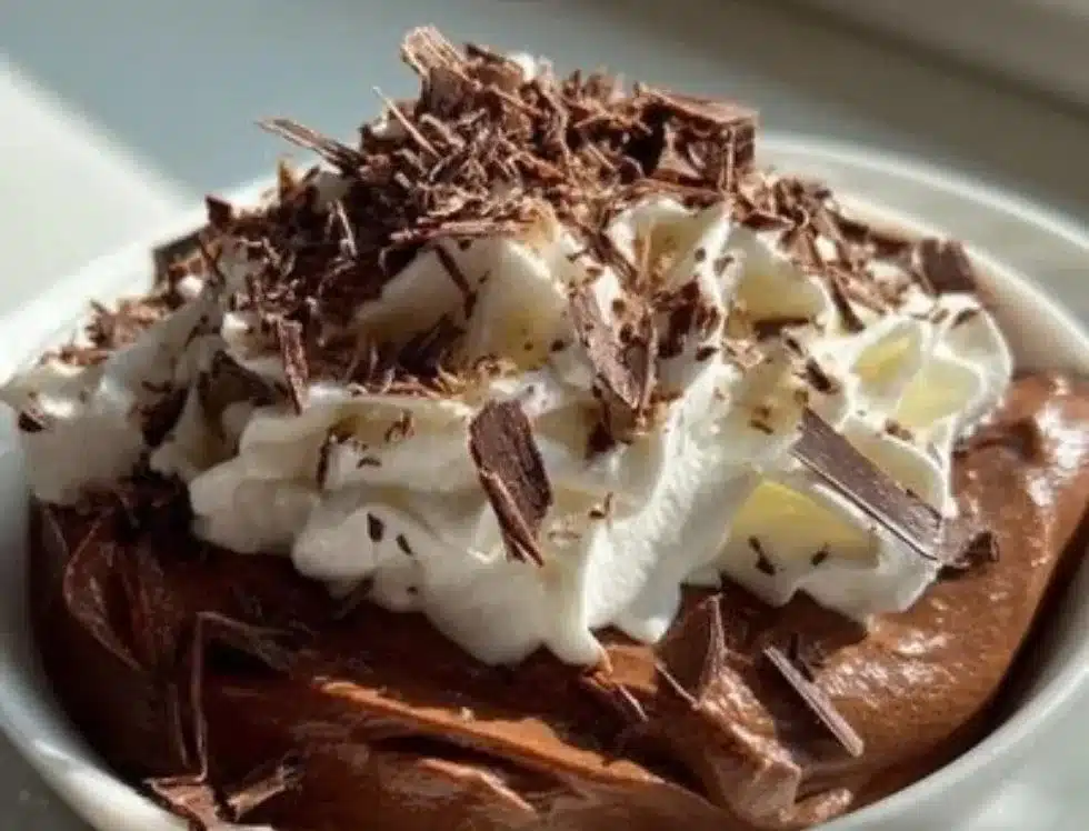 Decadent classic creamy chocolate mousse topped with chocolate shavings.