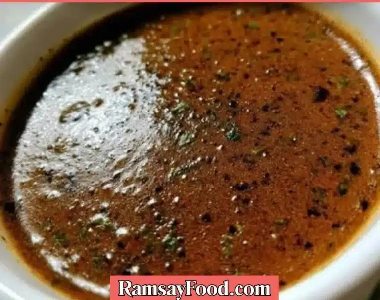 A bowl of homemade gravy made without drippings, served on a rustic table.
