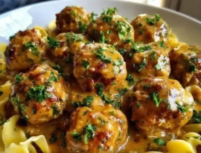 Creamy Meatball Stroganoff served on a plate with noodles and herbs