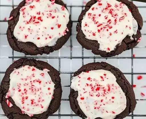 Delicious peppermint frosted chocolate cookies on a plate.