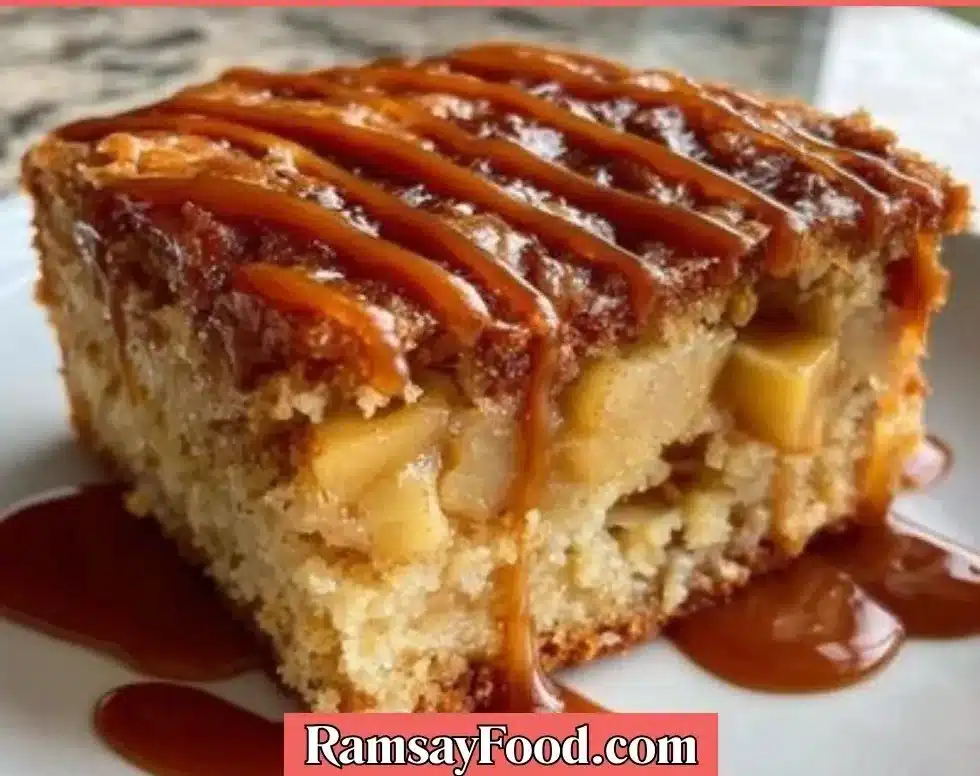 Slice of Salted Caramel Apple Sheet Cake topped with caramel drizzle