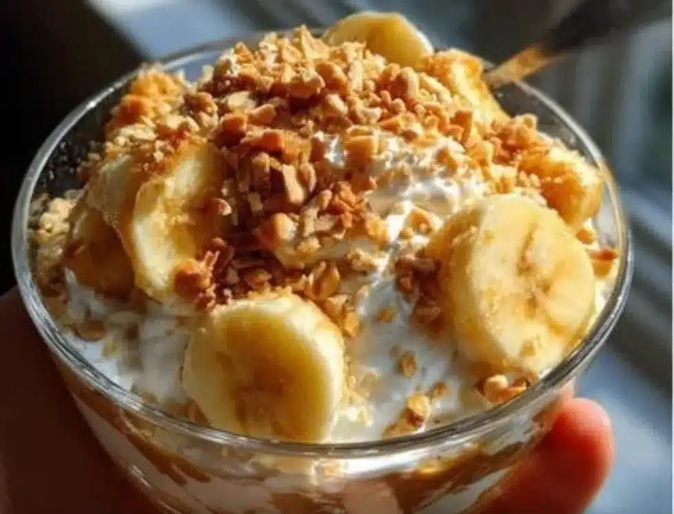 Salty Peanut Banana Pudding dessert with creamy layers and a topping of peanuts