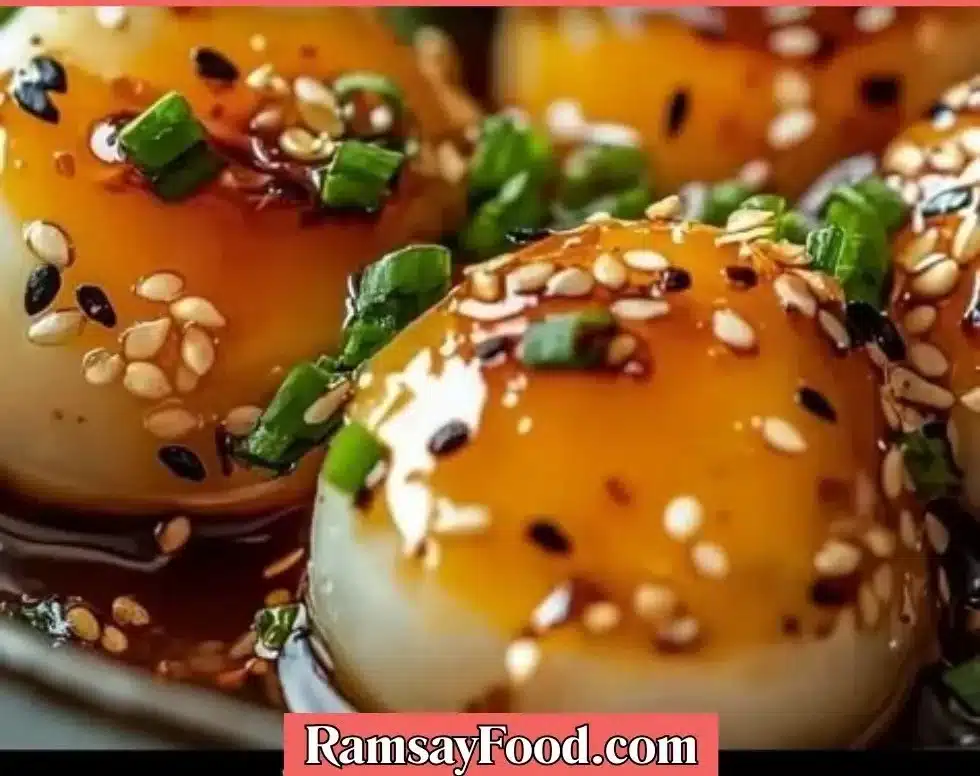 Soy sauce egg served on a plate, drizzled with rich soy sauce.